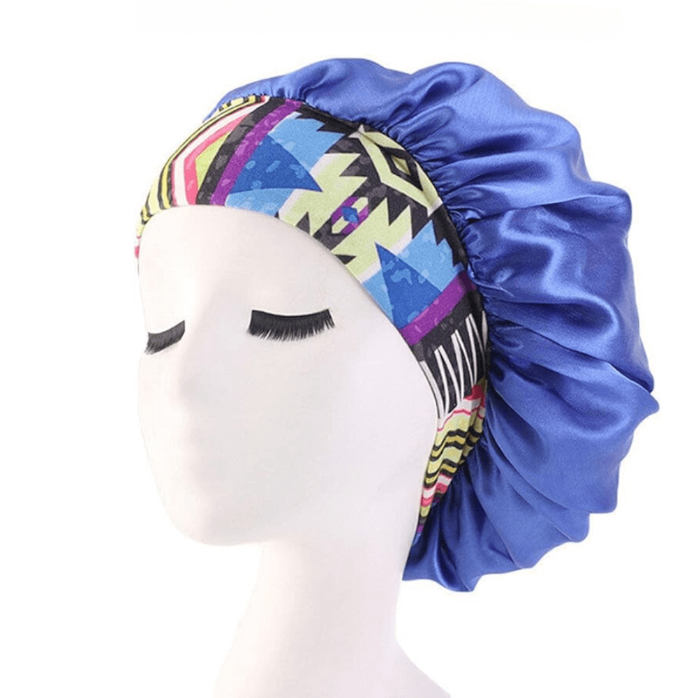 Blue aztec satin hair bonnet with printed band on a white background